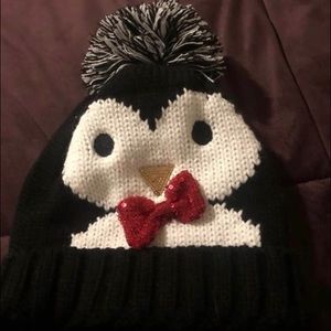 Matching penguin hat and glove set from Muk Luks